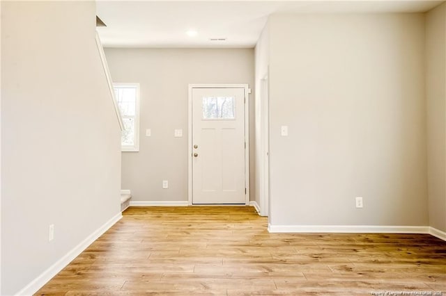 foyer entrance featuring recessed lighting, baseboards, and light wood-style floors