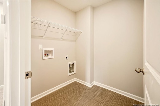 laundry area with washer hookup, laundry area, baseboards, and hookup for an electric dryer