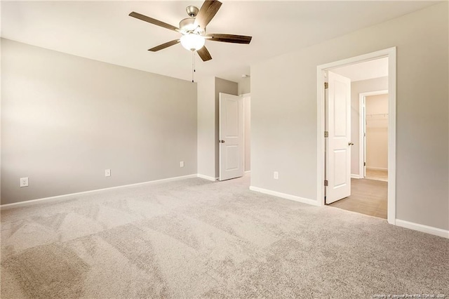 unfurnished bedroom featuring carpet flooring, ceiling fan, and baseboards