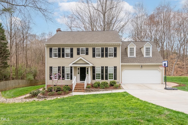 view of front of home featuring a front lawn, a garage, driveway, and a shingled roof