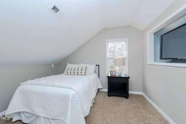 bedroom featuring vaulted ceiling, carpet flooring, baseboards, and visible vents