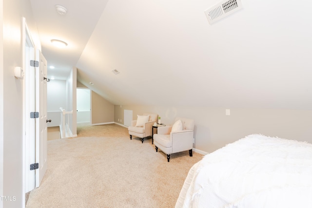 bedroom featuring light carpet, visible vents, baseboards, and vaulted ceiling