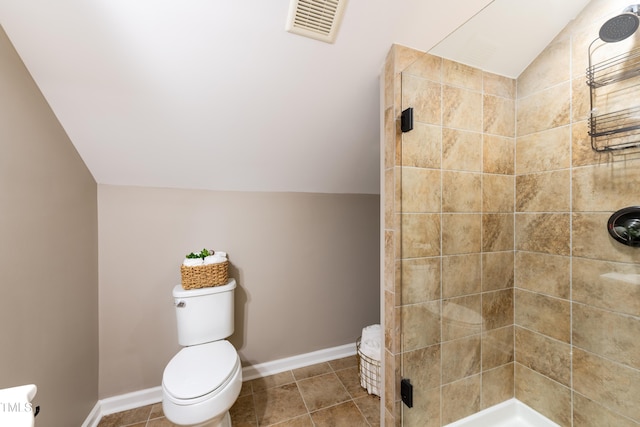 full bath with visible vents, toilet, a shower stall, tile patterned flooring, and lofted ceiling