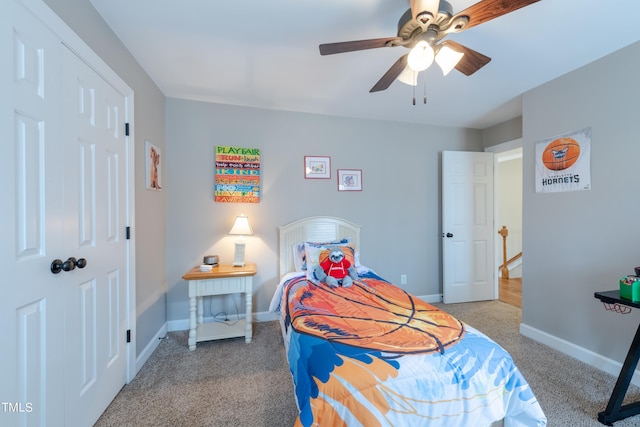 carpeted bedroom with baseboards and ceiling fan