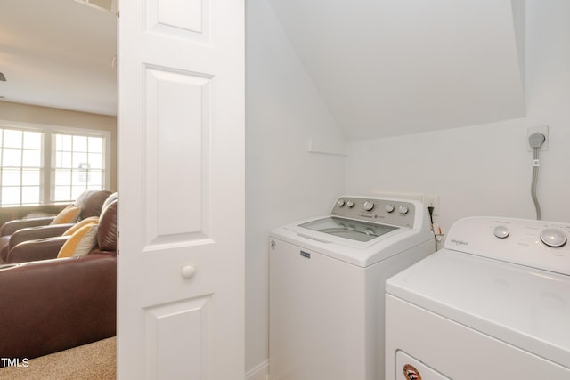 washroom with laundry area and washer and dryer