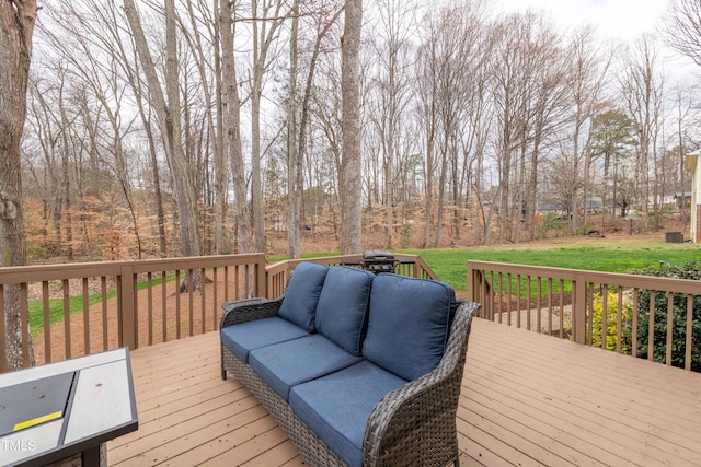 deck featuring an outdoor hangout area and a lawn