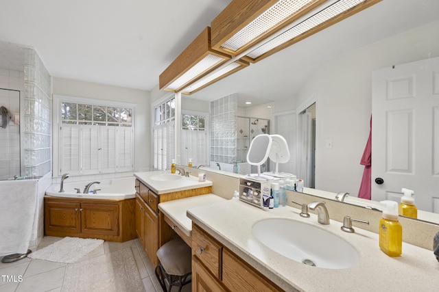 full bathroom with tile patterned flooring, a stall shower, a bath, and vanity