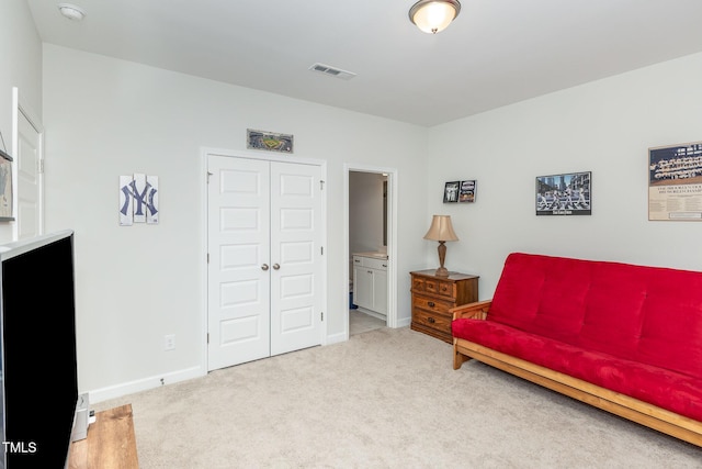 sitting room with baseboards, carpet floors, and visible vents