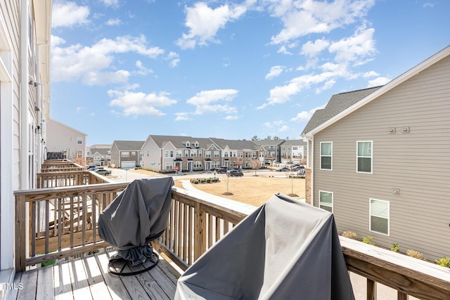 wooden terrace with a residential view