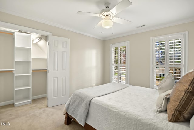 bedroom featuring visible vents, carpet flooring, crown molding, and baseboards