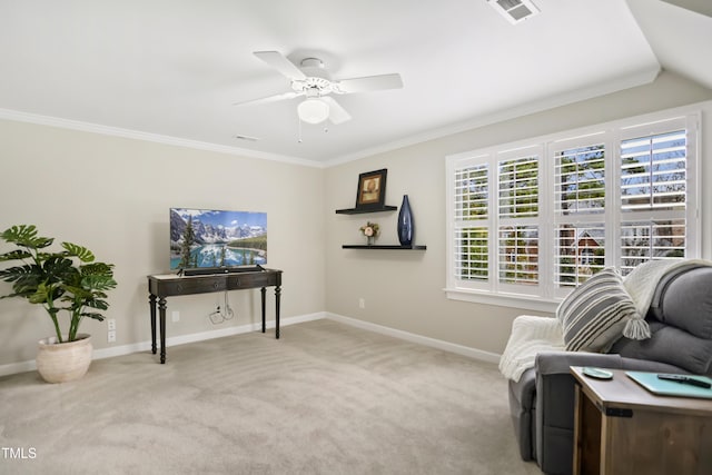 sitting room with crown molding, carpet, visible vents, and baseboards