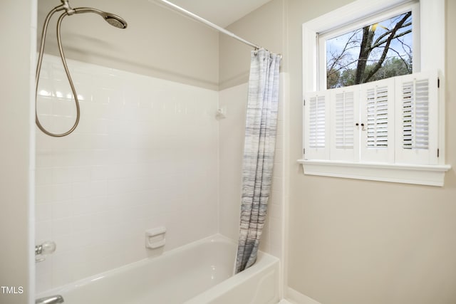 full bathroom featuring shower / bath combo with shower curtain