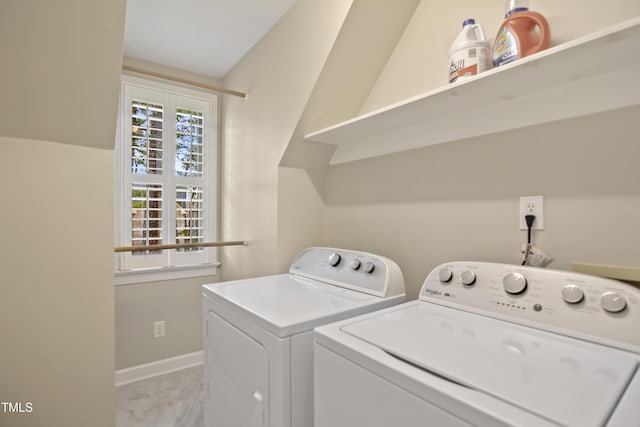 washroom with washer and clothes dryer, laundry area, marble finish floor, and baseboards