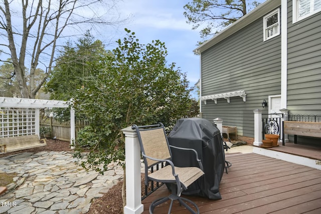 wooden terrace with fence and grilling area