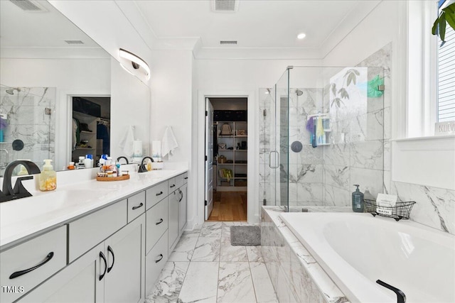 full bath featuring a spacious closet, a stall shower, a bath, and crown molding