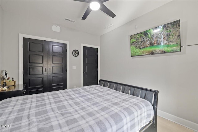 bedroom with visible vents, baseboards, and ceiling fan