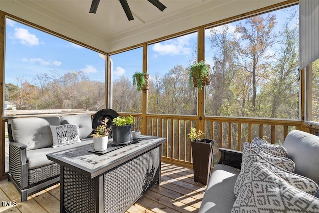 sunroom with a ceiling fan and a healthy amount of sunlight