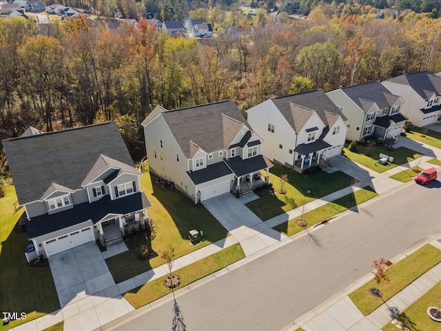 bird's eye view featuring a residential view and a view of trees