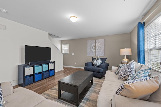 living room with wood finished floors and baseboards