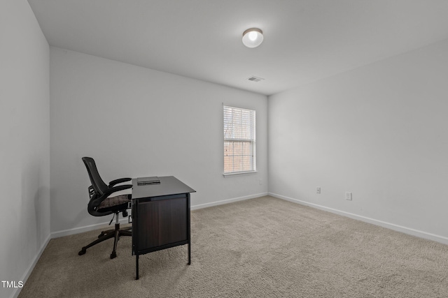 office area featuring visible vents, baseboards, and carpet