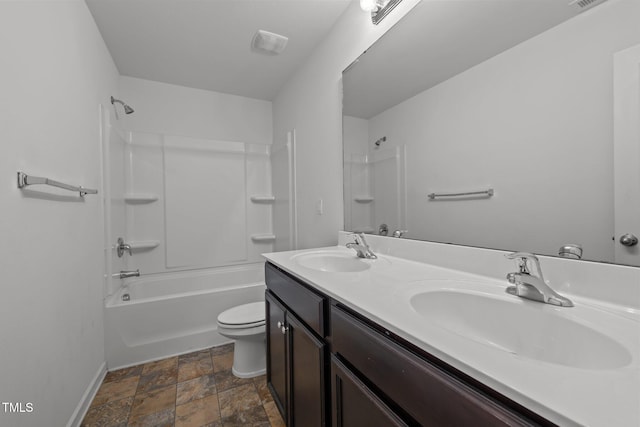 full bathroom with double vanity, toilet, bathing tub / shower combination, and a sink