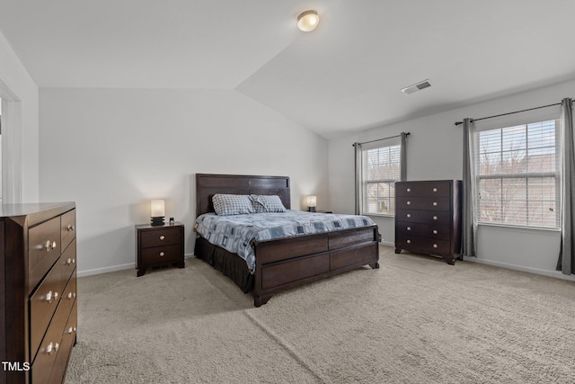 bedroom featuring vaulted ceiling, light colored carpet, visible vents, and baseboards