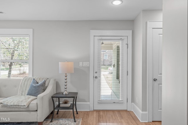 interior space with visible vents, baseboards, and light wood-style flooring