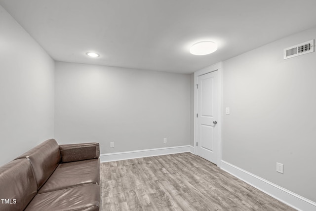 unfurnished room with visible vents, baseboards, and wood finished floors