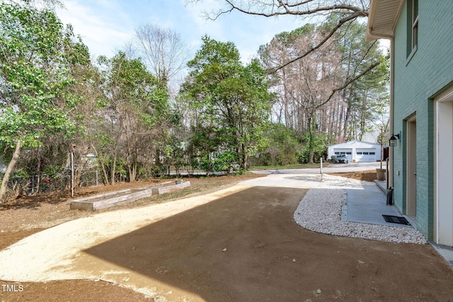 view of yard featuring concrete driveway