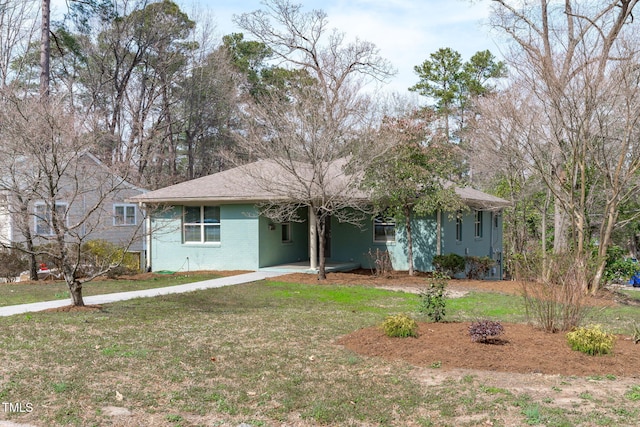 ranch-style house with brick siding and a front lawn