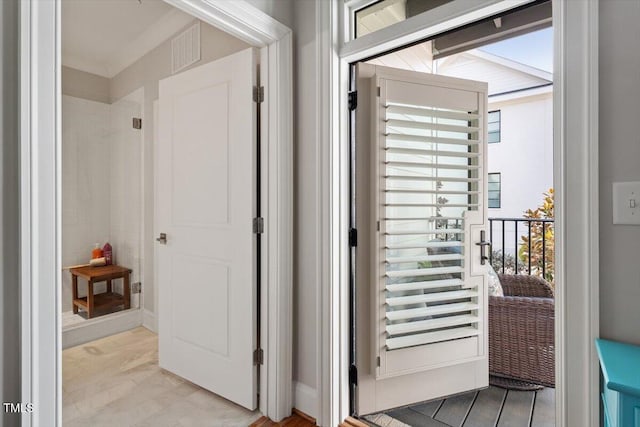 doorway with visible vents and wood finished floors