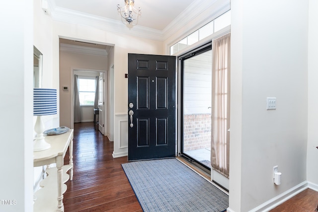 foyer entrance featuring dark wood finished floors, baseboards, and ornamental molding