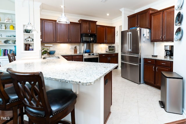 kitchen featuring a kitchen bar, ornamental molding, appliances with stainless steel finishes, a peninsula, and a sink