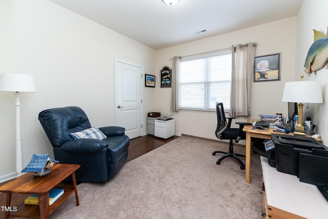 office area featuring visible vents and carpet floors