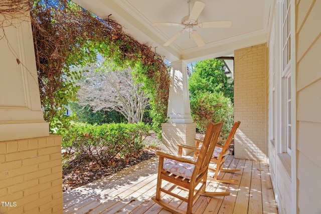 wooden terrace featuring a ceiling fan