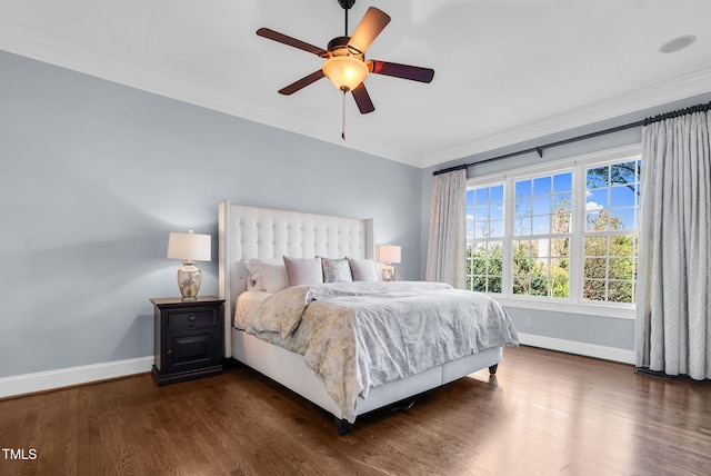 bedroom featuring a ceiling fan, crown molding, baseboards, and dark wood-style flooring