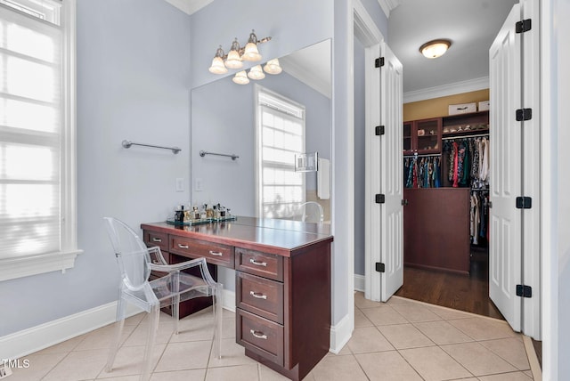 office featuring light tile patterned floors, baseboards, and ornamental molding