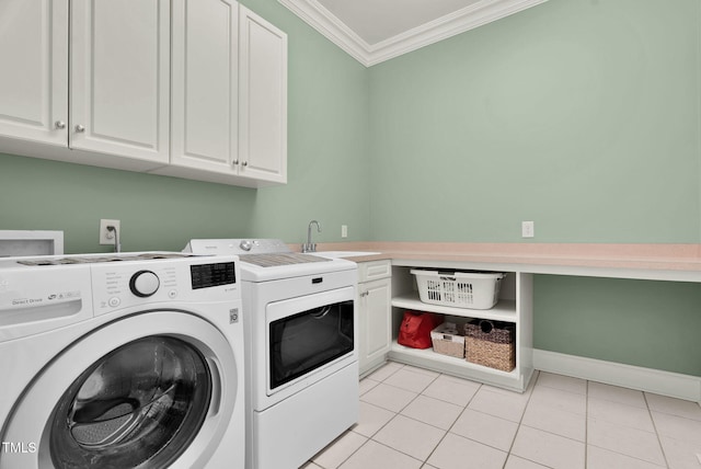 laundry room featuring light tile patterned floors, cabinet space, a sink, ornamental molding, and washer and clothes dryer