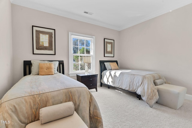 bedroom featuring visible vents, crown molding, baseboards, and carpet floors