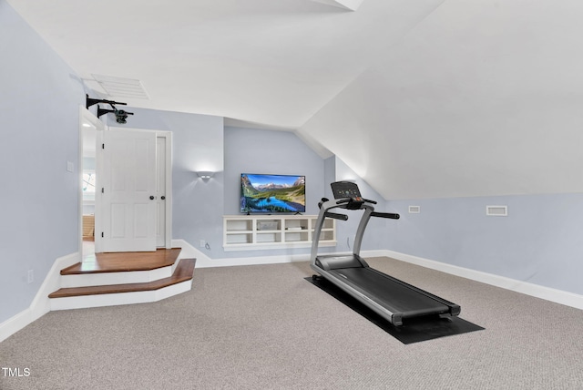 exercise area with baseboards, lofted ceiling, visible vents, and carpet flooring