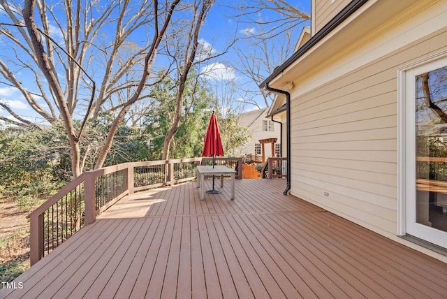 wooden terrace featuring outdoor dining space