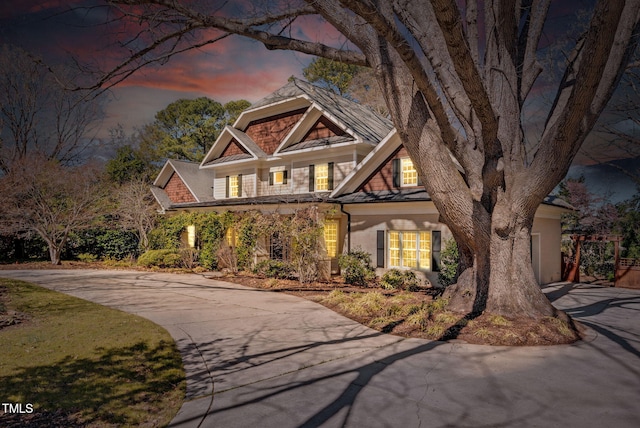 craftsman-style home with driveway