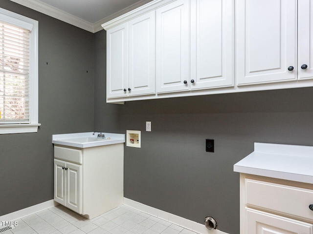 laundry room featuring washer hookup, ornamental molding, a sink, cabinet space, and light tile patterned floors