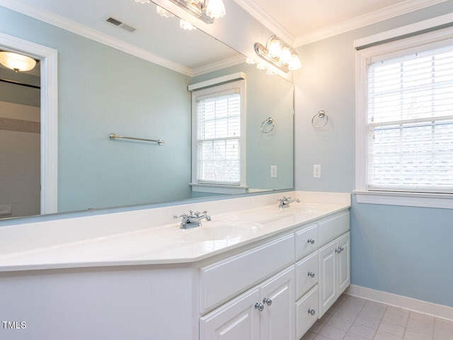 bathroom with baseboards, visible vents, double vanity, a sink, and crown molding