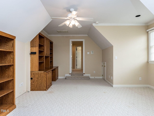 bonus room featuring visible vents, light colored carpet, baseboards, and ceiling fan