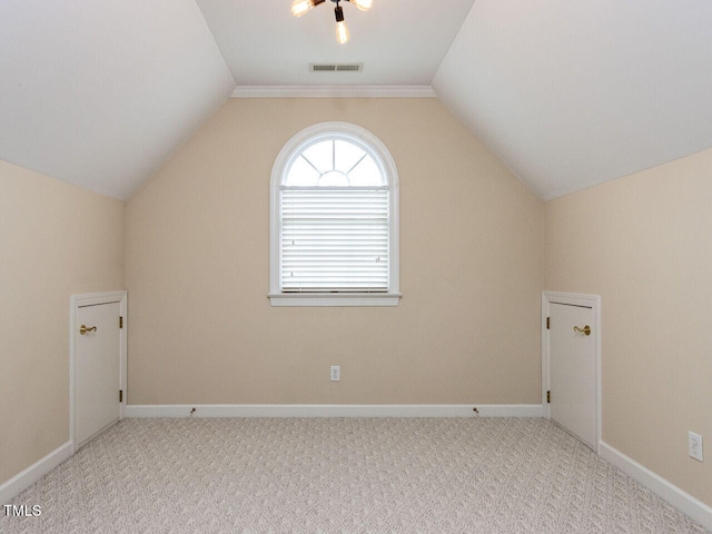 bonus room featuring visible vents, baseboards, lofted ceiling, and carpet floors