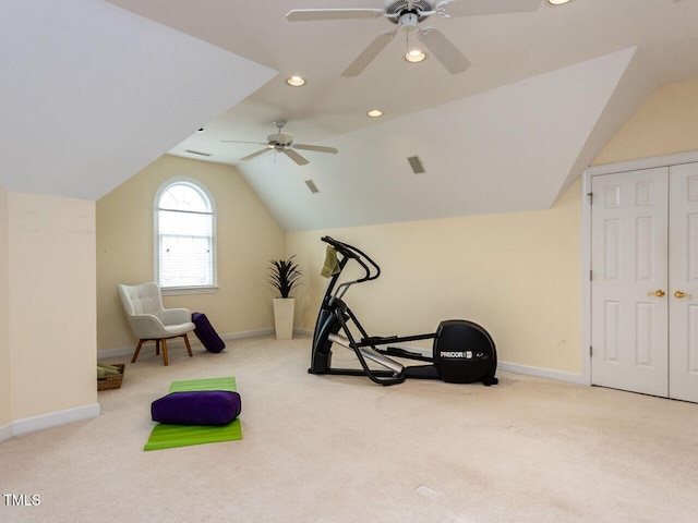 workout area with carpet, a ceiling fan, and vaulted ceiling