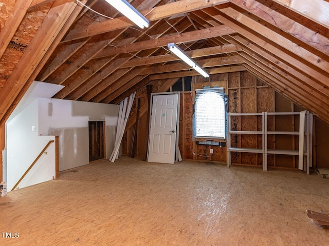 attic featuring an upstairs landing