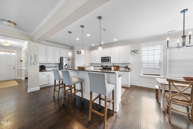 kitchen with a breakfast bar area, stainless steel appliances, dark wood-type flooring, dark countertops, and backsplash