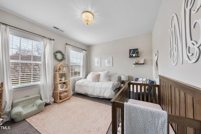 bedroom featuring carpet and visible vents